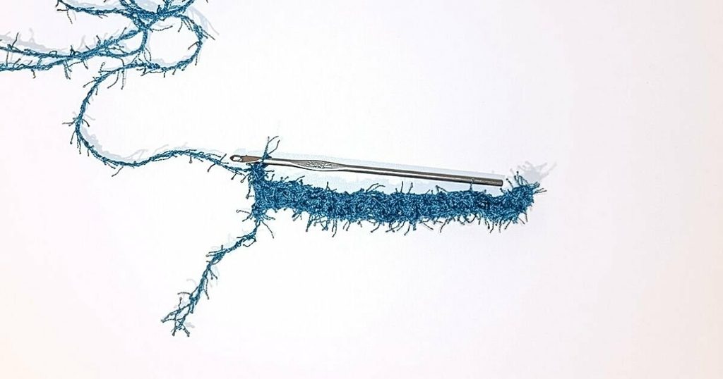 An image of single crochet stitches on scrubby yarn