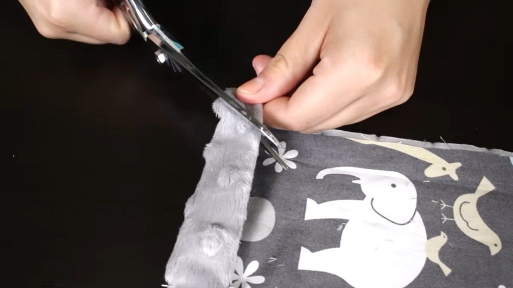 An image of trimming baby blanket corners