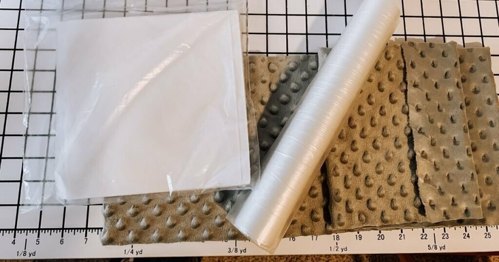 An image of minky fabric and embroidery supplies