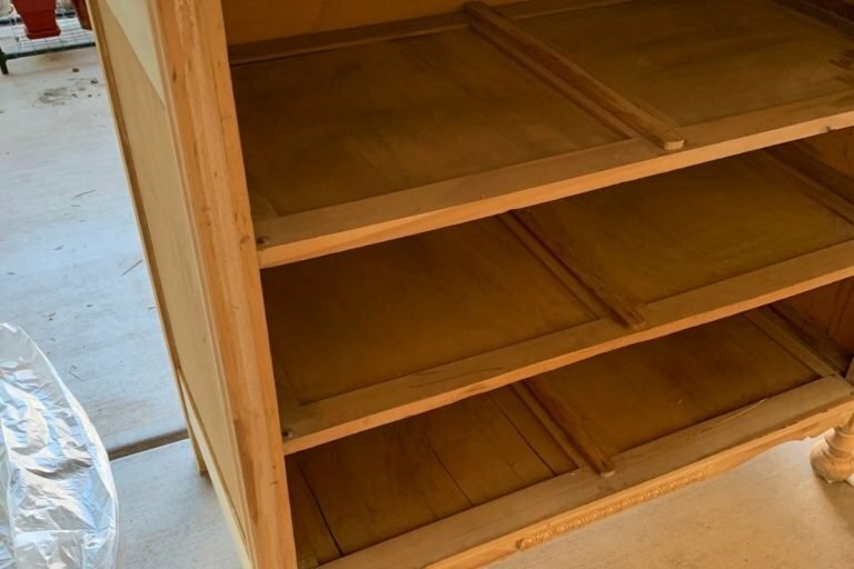 An image of a vintage dresser taken apart for restoration